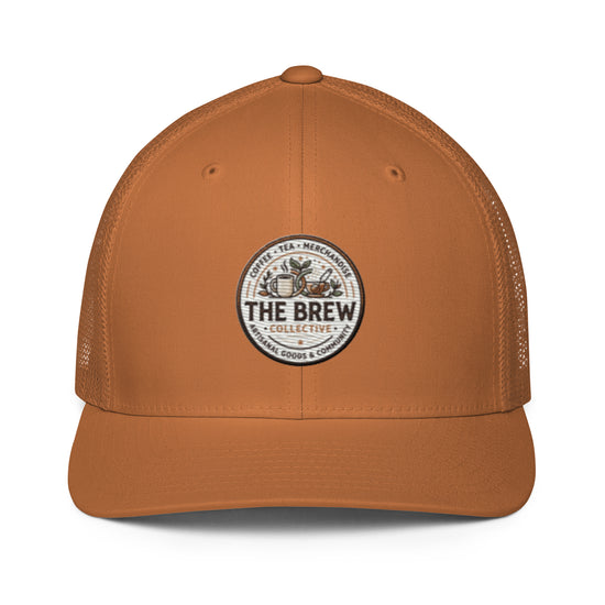 The Brew Collective trucker cap in orange with logo showcasing coffee and brewing accessories.