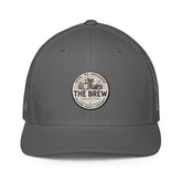 The Brew Collective trucker cap in gray with mesh back and round logo design for coffee enthusiasts.